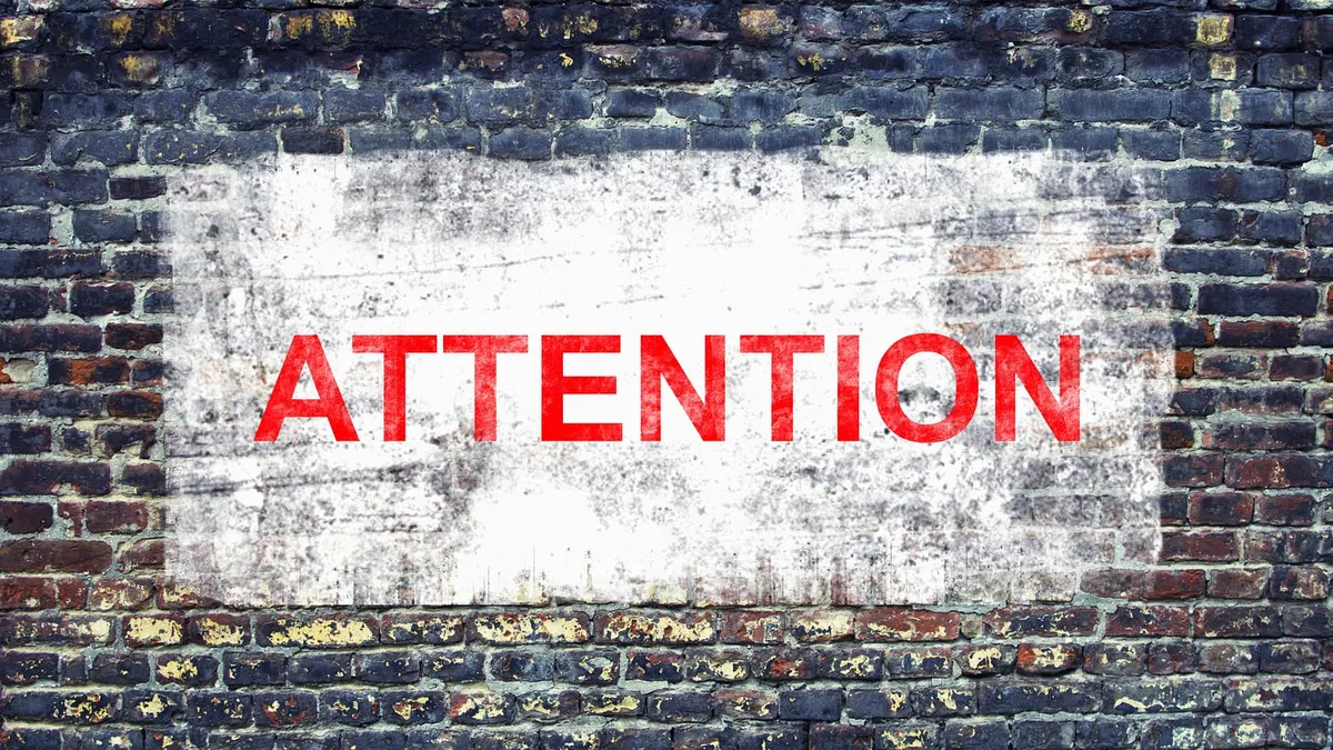 A white sign on a brick wall
AI-generated content may be incorrect.