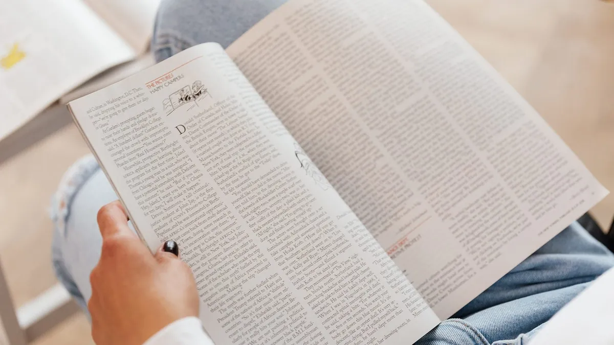 A person reading a book
AI-generated content may be incorrect.