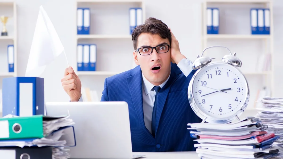 A person in a blue suit holding his ears in front of a clock

AI-generated content may be incorrect.