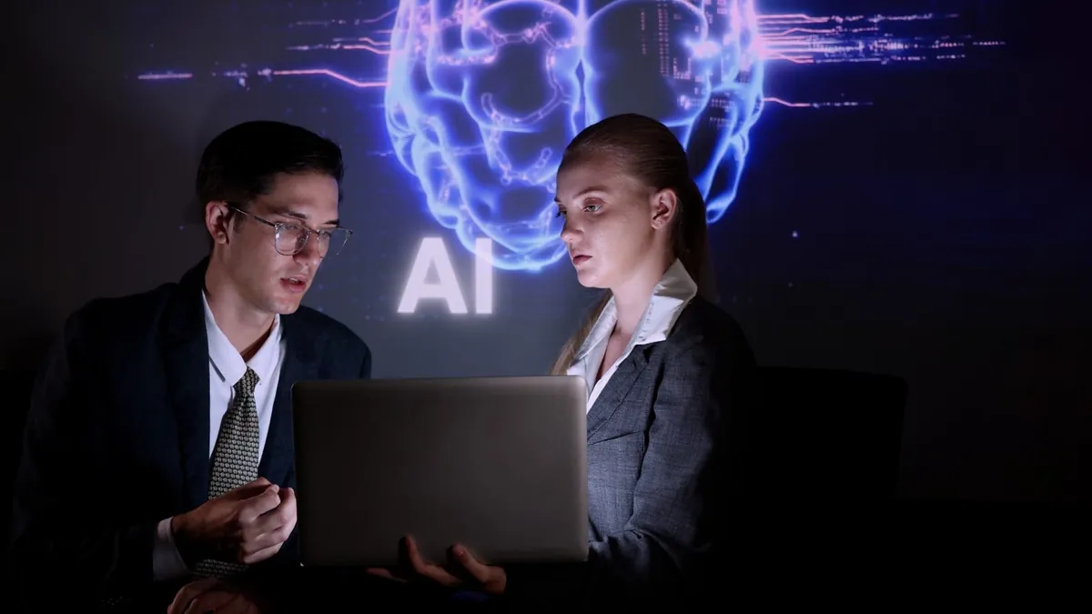 A person and person looking at a computer
AI-generated content may be incorrect.